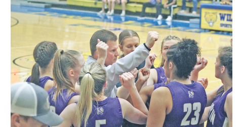 Girls basketball Head Coach David Dowse rallies the Lumpkin team during a timeout in the Lady Indians Final Four victory. The team will play in the finals this Friday.