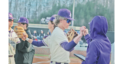 Lumpkin’s Peyton Wood and the Indians team celebrate after retiring the side against Gilmer last week.
