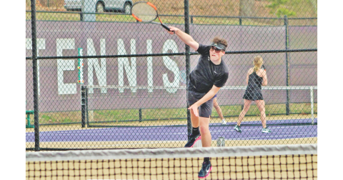 Senior Jack Lowry returns a volley during Lumpkin’s home match last week.