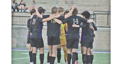 The Lumpkin County boys soccer team huddles up before their game against Wesleyan.