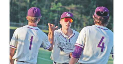 Lumpkin senior Landon Greene celebrates a diving catch during Lumpkin’s game versus Wesleyan.