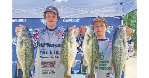 Walker Grizzle and Cooper McDonald show off their catches following a successful tournament on the water.