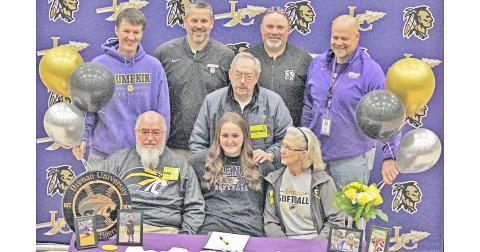 Lumpkin County senior Natalie Shubert celebrates her college signing along with her family and coaches.