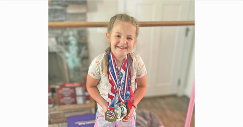 Lumpkin gymnast Jenna Watkins shows off the medals she earned at the State Championship meet.