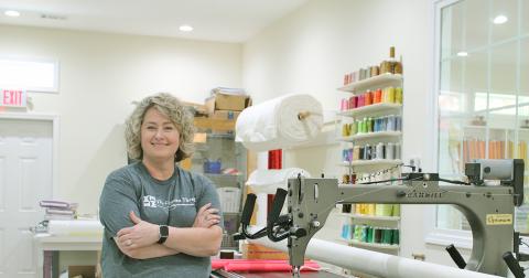 Shannon Caldwell shows off her automated Gammill longarm machine at The Common Thread.