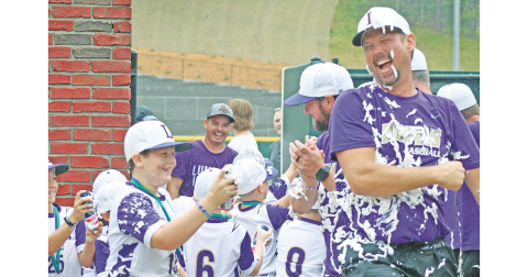 Coach Tucker Greene, Carson Rogers and the 8U baseball All-Stars celebrate their State Championship with a joyful shaving cream shower after securing the title with a win over Dodge County.