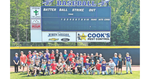 Lumpkin’s young baseball athletes soak up the sun during a group photo following a very successful summer camp.