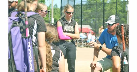 NGG Softball coach Quentin Sears motivates his team following the teams first victory of the tournament, that earned them a second seed standing going into the remainder of games for the event.
