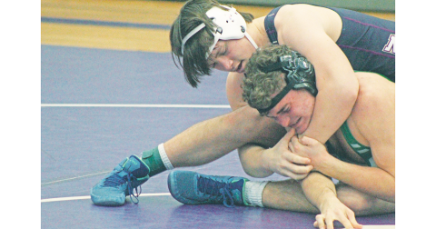Mike Nichols’ opponent squints in pain as he attempts a cradle.