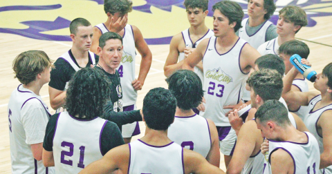 Head Coach Chris Faulkner breaks down strategy during a summer game against East Forsyth.