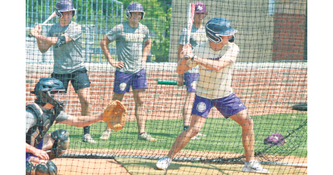 Lumpkin’s Colton Lee steps up to bat, while Kendal Lee sits steadily as the catcher, and Matthew Mitchell, Adian Rogers and Chase Smith look on.