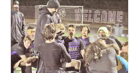 Head Coach Brent Howell talks to his Lumpkin soccer team following a game last season.
