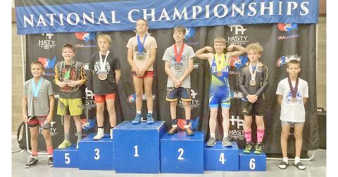 Lumpkin’s Liam Nielsen stands on the 4th place podium at the Kids Nationals competition.