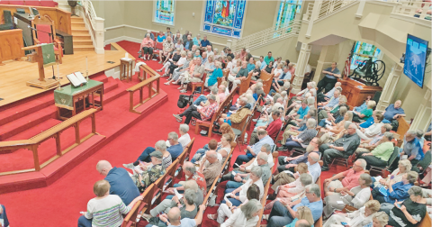 A crowd gathers in the sanctuary of Dahlonega United Methodist Church on August 6 as an overwhelming majority of the members ultimately voted to disaffiliate from the United Methodist Church.