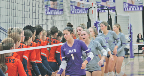 The Lumpkin County High School volleyball team shakes hands with Habersham after their victory.