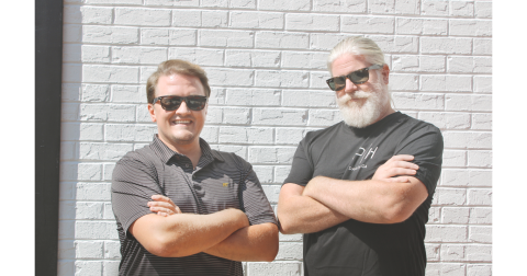 New restauranteurs Ryan Reagin, left, and Tracy Huggins take a quick break from their busy day on the outdoor patio of the new Public House Kitchen & Cocktails.