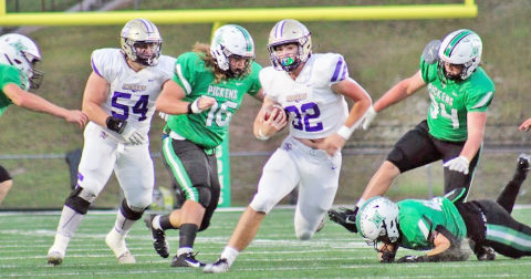 Lumpkin running back Mason Sullens powers through the Dragons’ defensive line. (Photo curtesy of Carrie Roy)