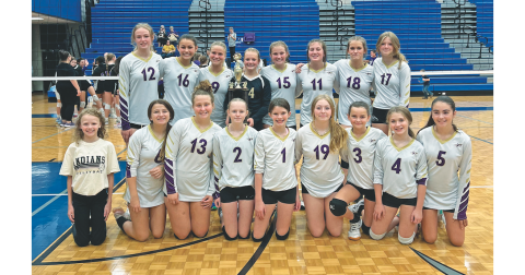 The Lumpkin County Middle School volleyball team celebrates with their new Mountain League Championship trophy.