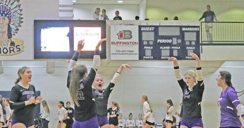 The Lumpkin Lady Indians celebrate scoring a point against Wesleyan.