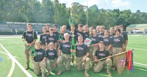 The Lumpkin Raider squad with their newly earned trophy after a hard-fought competition at Grayson High School.