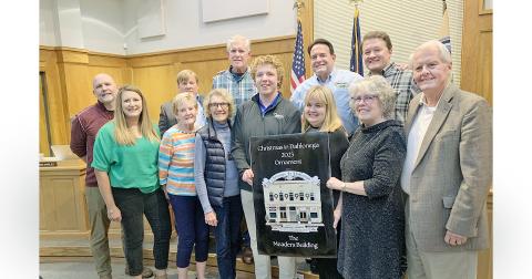 The much anticipated Community Helping Place fundraising ornament was unveiled at the Dahlonega City Council meeting earlier this month. This year's ornament features the golden facade of the Meaders Building. (Photo by Matt Aiken)