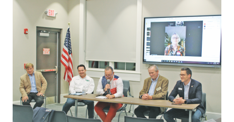 Candidates for Dahlonega City Council participate in a public forum at the local library. Pictured are (from left) current Council members Johnny Ariemma and Lance Bagley, James T. Guy, Tom Gordineer, Dan Brown and appearing via Zoom video, Melanie Dunlap.