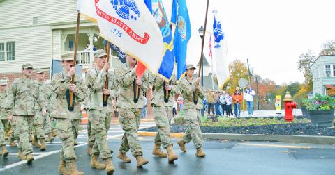 The Lumpkin County High School JROTC displays the flags during the Veterans Day Parade in Dahlonega.