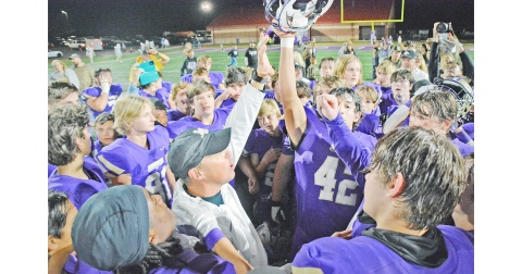 Head coach Heath Webb celebrates with the team after Lumpkin’s round two playoff victory over Oconee. (Photo by John Bynum)