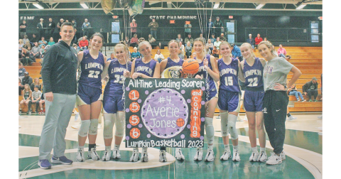 The Lady Indians Basketball team celebrates Averie Jones’ huge accomplishment of breaking the all-time scoring record. (Photo by Eligha Roper))