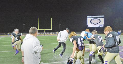 Head Coach Heath Webb gets a celebratory Gatorade bath after Lumpkin County’s victory over Gordon Lee on Friday night.