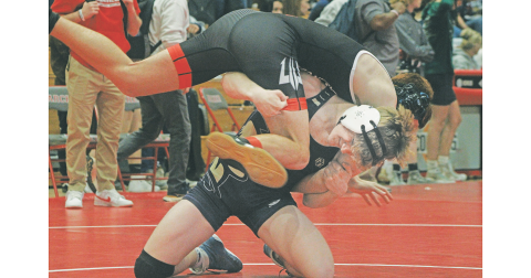 Lumpkin County wrestler Nathan Nielsen lands a fireman carry takedown on his opponent.
