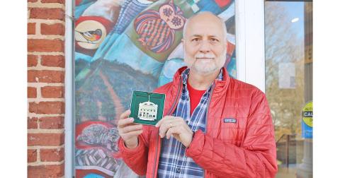 Dr. Jon Melhferber displays the 2023 Christmas In Dahlonega collector’s ornament he helped design.