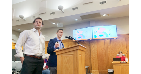 During the recent City Council public hearing, consultant Logan Moye, left, and zoning attorney Ethan Underwood discuss the proposal that could bring a 228-unit townhome development to a 62.77 acre plot just off of Pinetree Way in downtown Dahlonega.