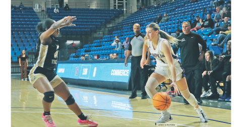 Maddie Lee drives to the hoop in Lumpkin’s game against Commerce at UNG last week.