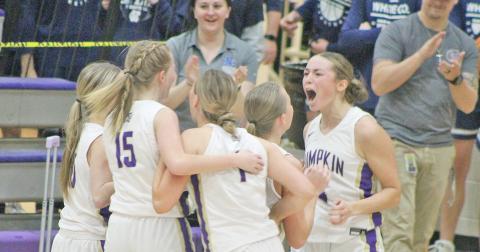 Lumpkin senior Averie Jones (right) and her teammates celebrate the big win over the Warriors.