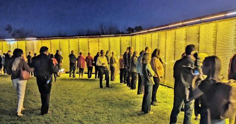Evening visitors in Spartanburg, South Carolina view The Wall That Heals during a stop on the popular exhibit’s 2023 tour. The wall will visit Dahlonega at the end of October. (Submitted photo)