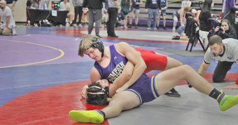Eighth ranked Will Soles pins one of his opponents at the Gold City Holiday Nutcracker tournament.