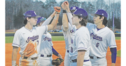 The Lumpkin County High School baseball team rallies together before storming the field against the Fannin County Rebels.