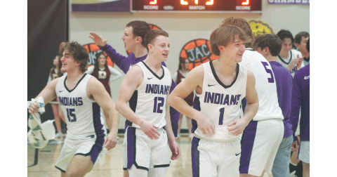 Teammates, from left, Colton Hamm, Stephen Sherrill and Luke Evans celebrate an Indians victory after a recent Lumpkin County game.