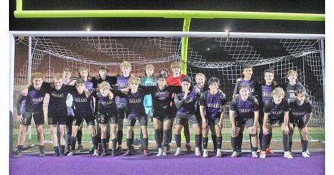 The LCHS varsity boys team celebrates following their big win over Calhoun.