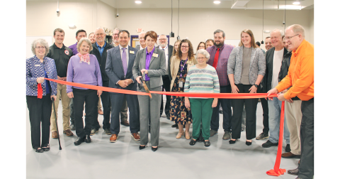 Lumpkin County Superintendent Sharon Head cuts a ceremonial ribbon in the College & Career Academy’s agricultural lab as local school board members, elected officials and project managers look on.