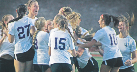 The Lumpkin County High School Indians celebrate their big win after a penalty kick showdown with the Dawson County High School Tigers.