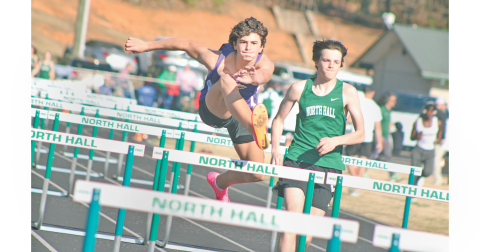 Lumpkin’s MacLane Powell hurdles his way to a first place finish at North Hall.