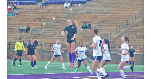 Kaitlyn Johnson lands a header during the team’s game against White County.