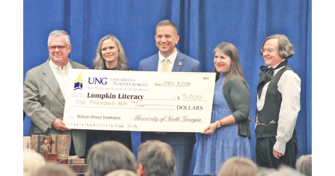 Pictured, from left, Lumpkin Literacy Chair Emeritus Geoffrey Kridel, UNG First Lady Jessica Shannon, UNG President Michael Shannon, Lumpkin Literacy Chair Caroline Smith, and Dr. Brian Corrigan were all smiles as UNG presented a check for $5,000 to Lumpkin Literacy. (Photo by Keith Murden / The Nugget)