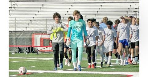 Boegner leads his team onto the field in Dalton for the GACA All-State game.