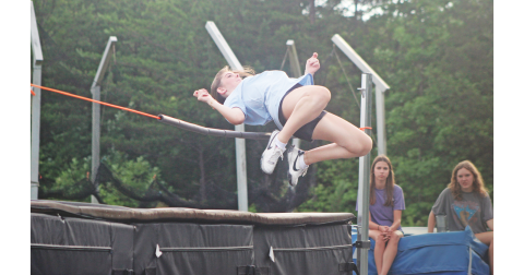Lumpkin County athlete Brynli Gilreath demonstrates how to do a high jump during the recent summer camp.