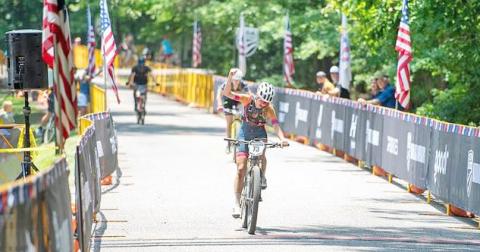 Shiloh Claussen celebrates crossing the finish line at MTB Marathon Nationals. (submitted photo)