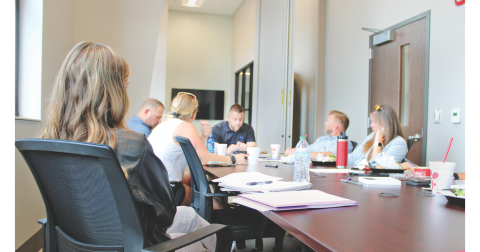 Parks & Rec Manager Tim Towe (center) reviews summer sports registration with members of the Citizens Advisory Committee at Pinetree Recreation Center.