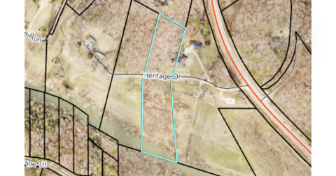 An image from the qPublic.net website shows parcel 064 065, where the new kayak takeout will be located. Heritage Drive cuts through the center of the property, with Chestatee River access visible on the south end.
